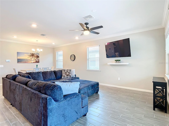 living room featuring ceiling fan with notable chandelier and ornamental molding