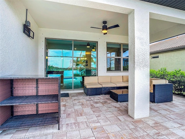 view of patio with ceiling fan and an outdoor hangout area