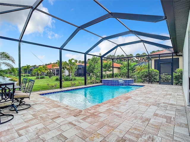 view of swimming pool featuring an in ground hot tub, a patio, and glass enclosure