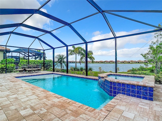 view of swimming pool featuring an in ground hot tub, a water view, a lanai, and a patio area