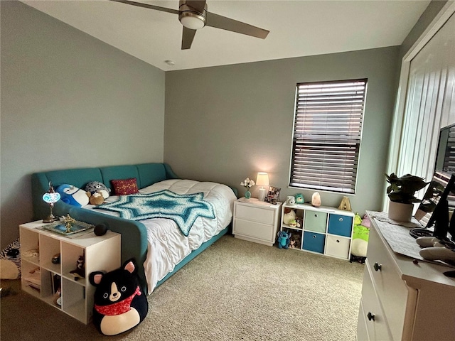 carpeted bedroom featuring ceiling fan