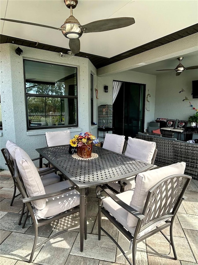 tiled dining area with ceiling fan