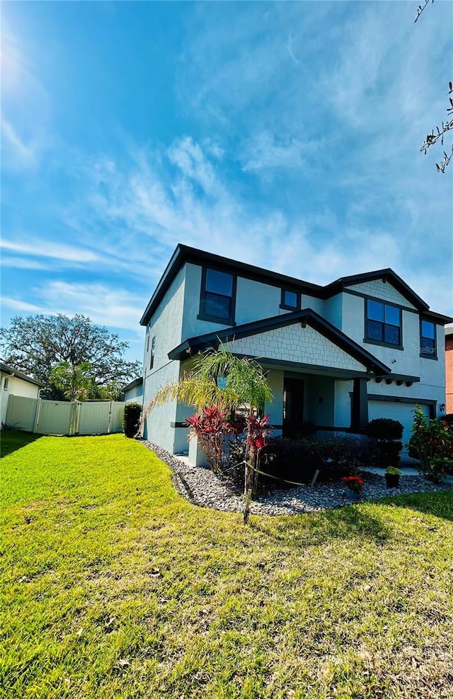 view of front of home with a front lawn