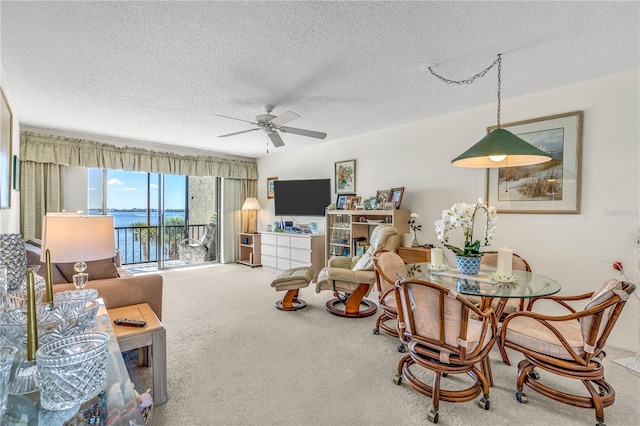 interior space with a textured ceiling and ceiling fan