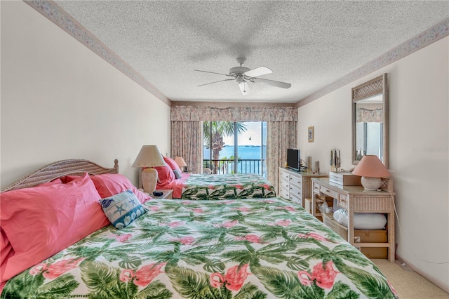 bedroom featuring ceiling fan, access to exterior, carpet floors, and a textured ceiling