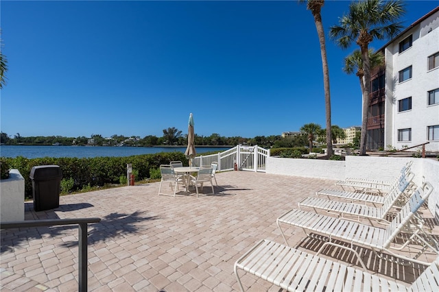 view of patio featuring a water view