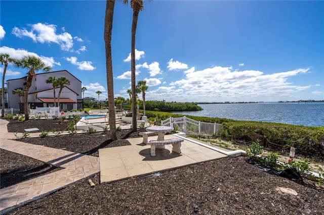 view of patio with a water view