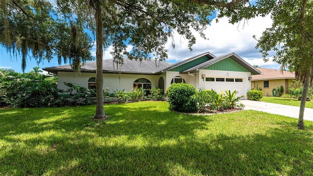 ranch-style house featuring a front yard and a garage