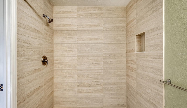 bathroom featuring a tile shower