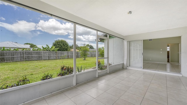 unfurnished sunroom featuring a wealth of natural light