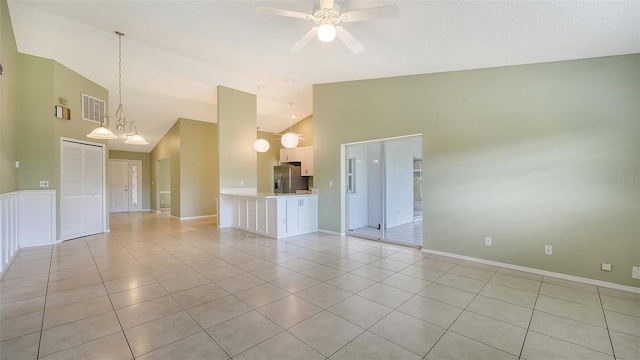 unfurnished room featuring ceiling fan, high vaulted ceiling, and light tile patterned floors