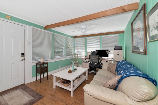 living room with beamed ceiling, wood-type flooring, and ceiling fan