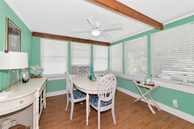 dining room with beamed ceiling, hardwood / wood-style flooring, and ceiling fan