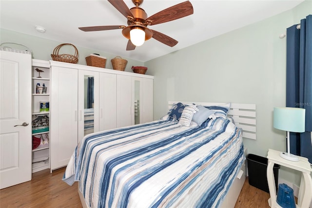 bedroom featuring light hardwood / wood-style floors and ceiling fan