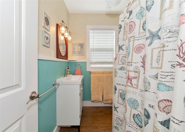 bathroom featuring a shower with curtain, vanity, and hardwood / wood-style floors