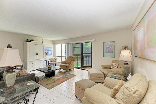 living area featuring a textured ceiling and light tile patterned flooring