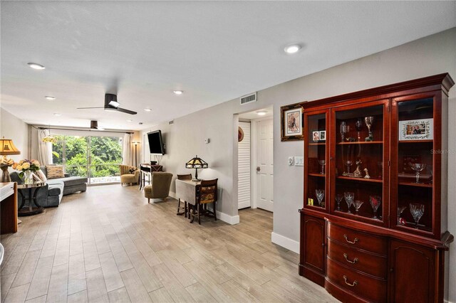 interior space featuring light hardwood / wood-style flooring and ceiling fan