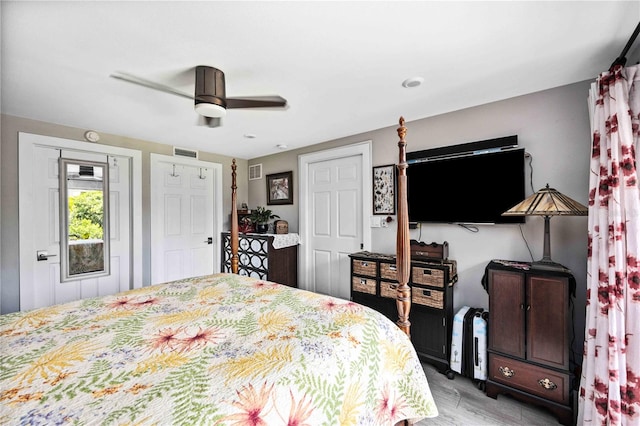 bedroom with light hardwood / wood-style flooring and ceiling fan