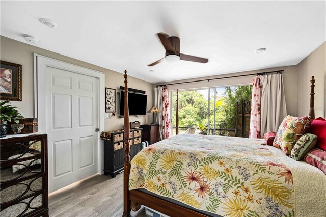 bedroom featuring access to exterior, ceiling fan, and light hardwood / wood-style flooring