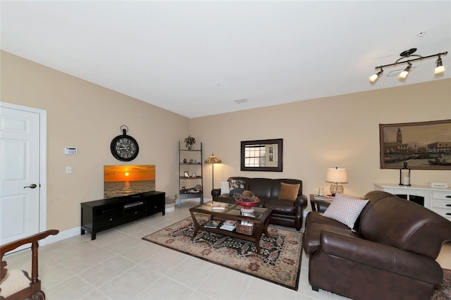 tiled living room featuring track lighting