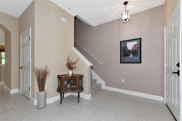 foyer entrance featuring light tile patterned floors