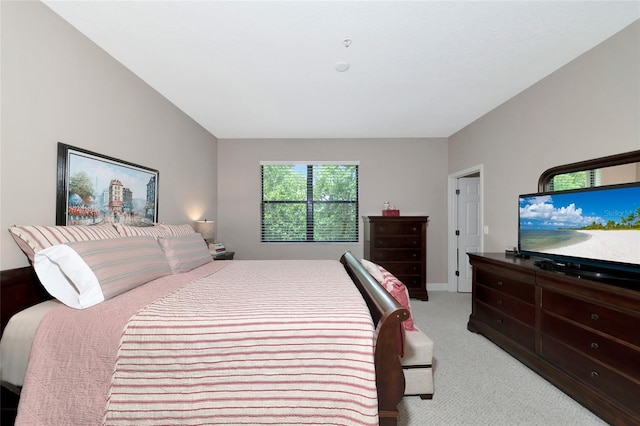 bedroom featuring light colored carpet