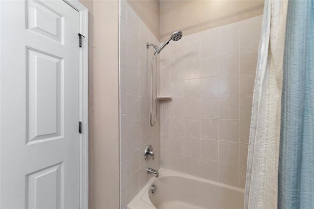 bathroom with shower / bathtub combination with curtain