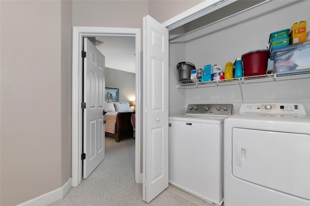 laundry area featuring washing machine and dryer