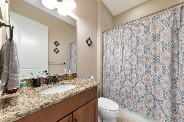 bathroom with tile patterned floors, vanity, and toilet