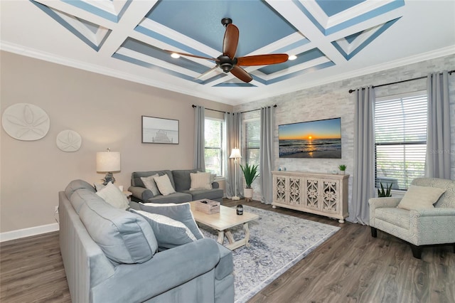 living room with ceiling fan, wood-type flooring, ornamental molding, and coffered ceiling