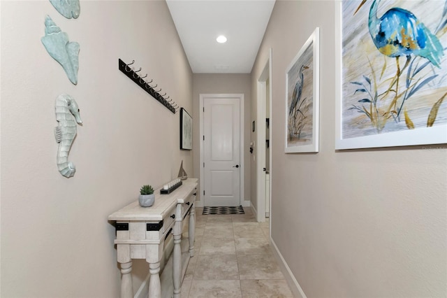 hall with light tile patterned flooring