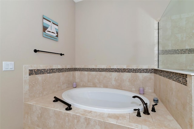 bathroom featuring tiled bath