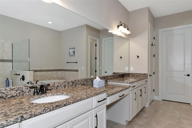 bathroom with dual vanity and tile patterned floors