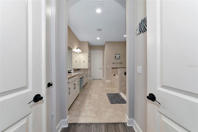 bathroom with vanity and tile patterned flooring