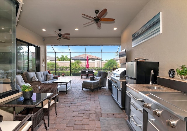 interior space featuring sink and ceiling fan