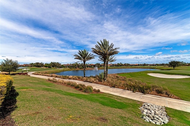 view of property's community featuring a water view and a lawn