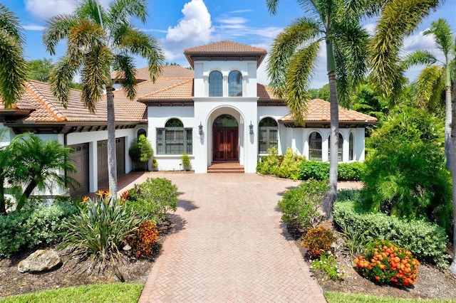 mediterranean / spanish house with a garage