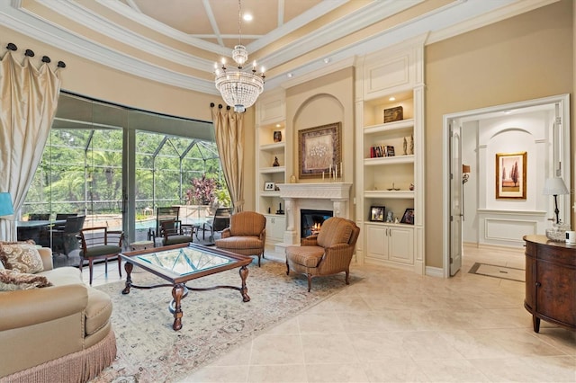 tiled living room with built in features, an inviting chandelier, a high ceiling, crown molding, and a raised ceiling