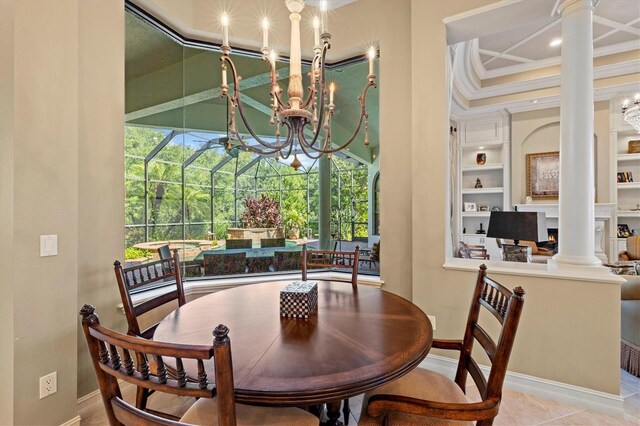 dining room featuring light tile patterned flooring, crown molding, a chandelier, built in features, and ornate columns