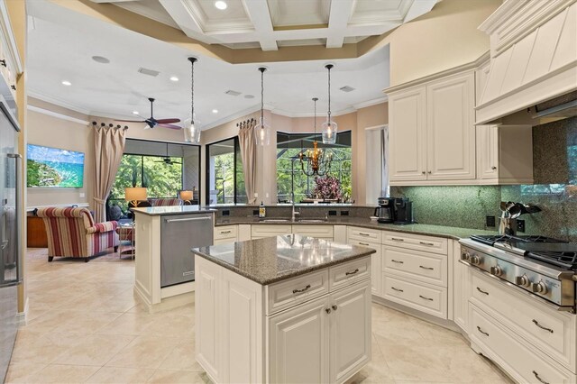 kitchen with backsplash, premium range hood, coffered ceiling, and a kitchen island