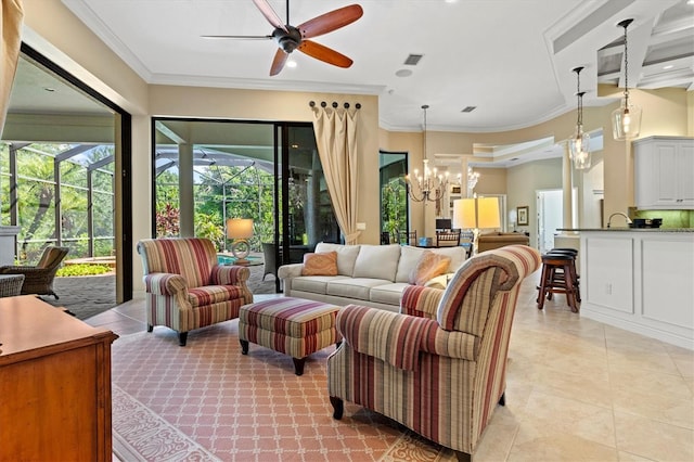 living room with ornamental molding, ceiling fan with notable chandelier, and light tile patterned floors