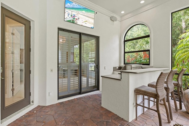 interior space with crown molding