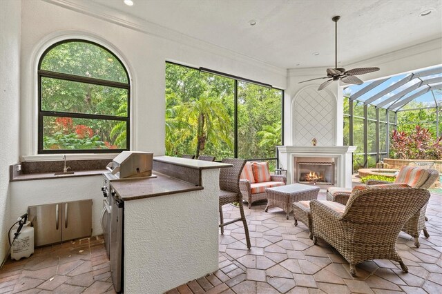 sunroom / solarium with ceiling fan and plenty of natural light