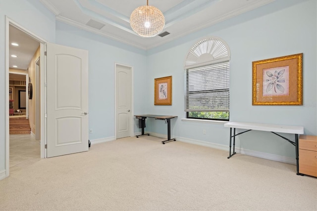 carpeted office space with ornamental molding and a raised ceiling