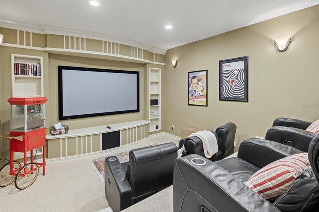 carpeted home theater featuring built in shelves