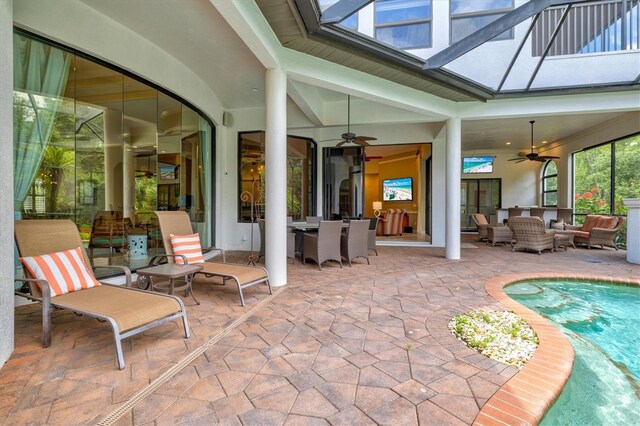 view of patio / terrace with an outdoor living space and ceiling fan