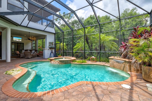 view of swimming pool featuring an in ground hot tub, a patio, ceiling fan, and glass enclosure