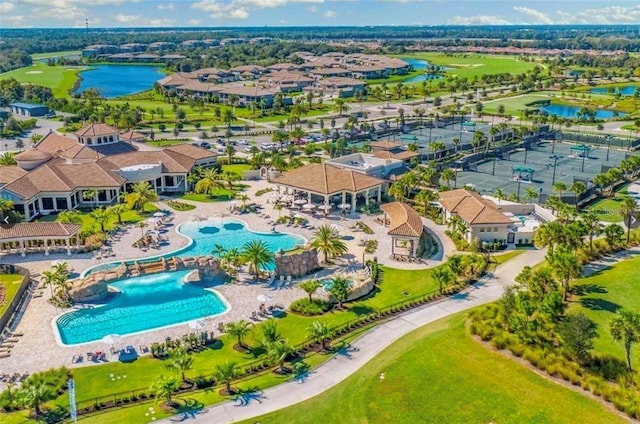 birds eye view of property with a residential view and a water view