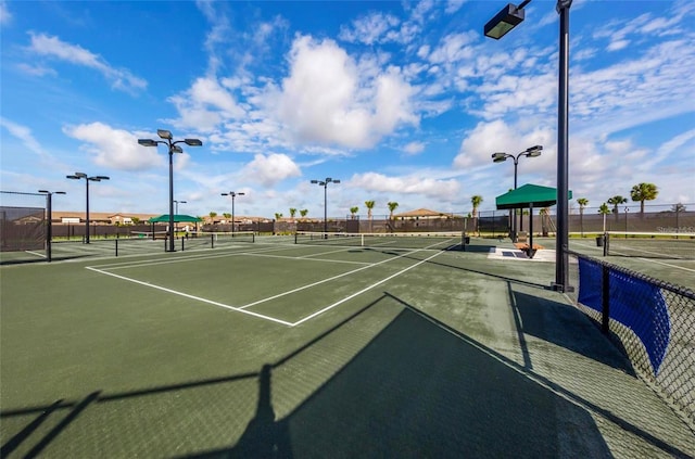 view of sport court featuring basketball hoop