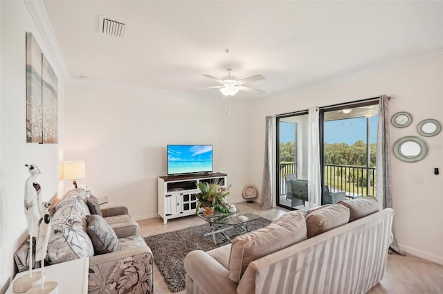 tiled living room with ceiling fan and ornamental molding